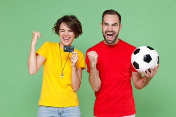 Joyful couple friends sport family woman man football fans in t-shirts cheer up support favorite...