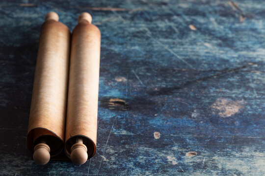 A Closed Antique Scroll on a Rustic Blue Wooden Table