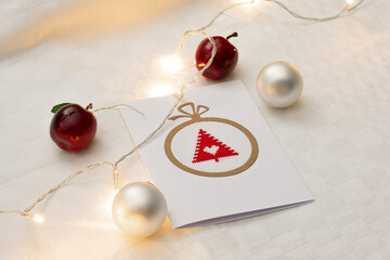 Naklejka na ściany i meble Handmade Christmas greeting card. Embroidered Christmas tree in the middle.