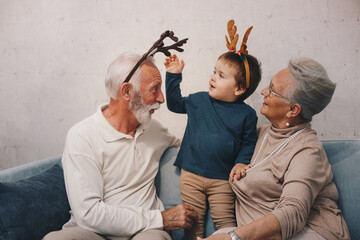 Old couple waring masks, looking through window