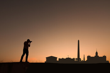 man next to Buenos Aires city skyline silhouette