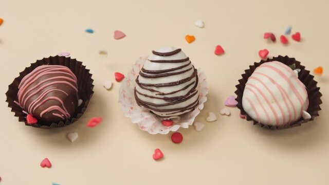 Tasty strawberry dipped in chocolate on color background
