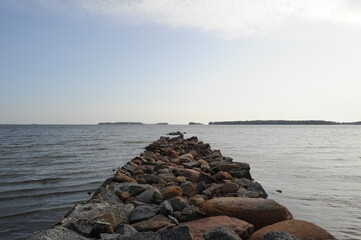 Fototapeta na wymiar Old stone jetty pointing towards the Baltic sea