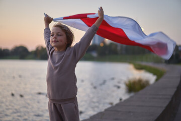 People at a protest in Belarus. Boy with a flag at a protest.