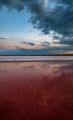 Sunset on the Genichesk pink extremely salty lake (colored by microalgae with crystalline salt depositions), Ukraine.