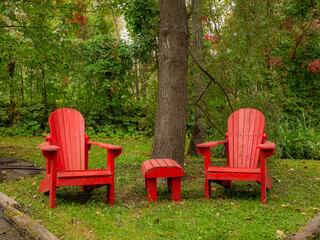 Fototapeta premium Couple of adirondack chairs in a quiet peaceful location