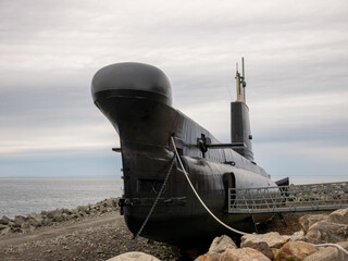 An old submarine exposed out of the water