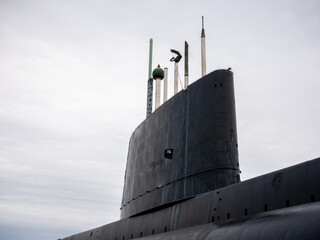 An old submarine exposed out of the water