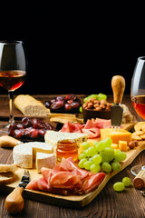 Plate with various snack for wine