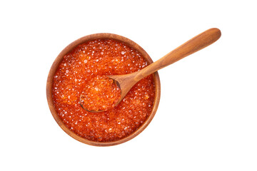 Red caviar in a wooden bowl and spoon with caviar isolated over white background. Top view