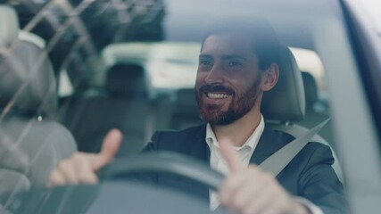 Smiling young attractive man beard driving car. Feel happy. Young businessman at sunlight. Close up. Automobile work city. Slow motion