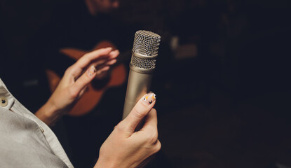 Image the announcer speaks into a microphone.