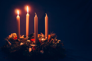 2. advent candle burning on advent wreath - 385368604