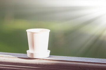 White disposable Cup on a uniform background