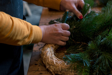 preparation and creation of christmas advent wreath from natural components