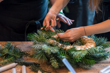 preparation and creation of christmas advent wreath from natural components