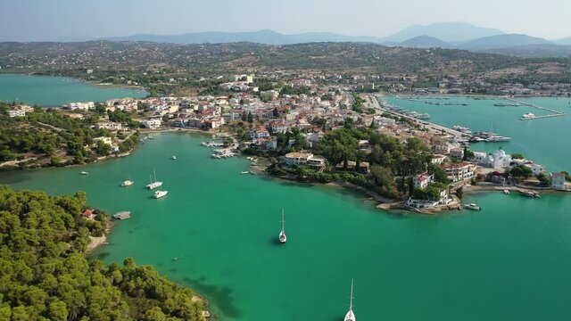 Aerial drone video of famous fjord seaside village and bay of Porto Heli in the heart of Argolida prefecture, Peloponnese, Greece