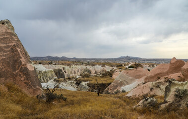 Unique colorful sandstone rock formations in the Rose Valley. Central Anatolia, Cappadocia, Turkey