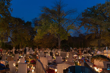 Glowing lights of cemetery during All Saints' Day in Poland