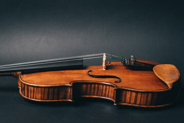 Fototapeta na wymiar beautiful violin musical instrument on black background. High quality photo