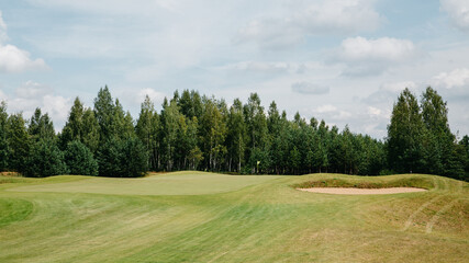 golf course with holes and green grass