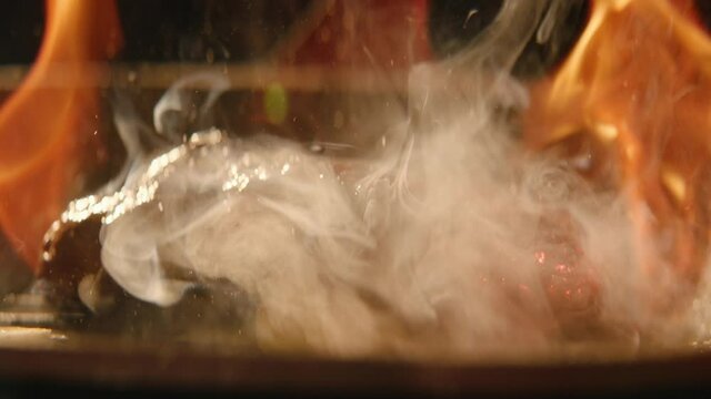 meat grilled on fire close-up