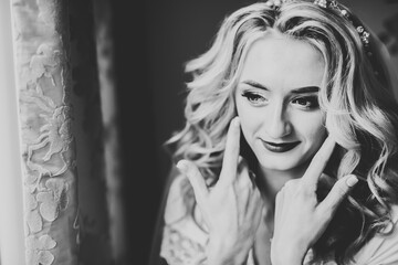 Beautiful bride wearing fashion wedding dress with feathers with luxury delight make-up and hairstyle, studio indoor photo shoot