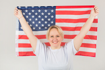 beautiful young plump woman with american flag on white background