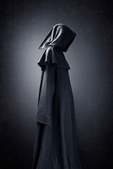 Scary figure in hooded cloak