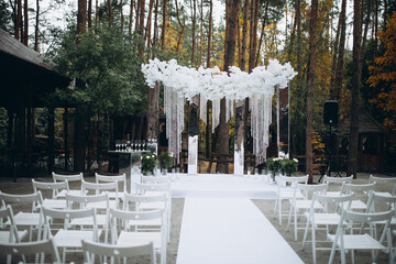 beautiful wedding set up ceremony in the park, white decoration