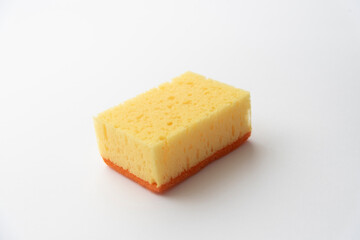 yellow dishwashing sponge on white background