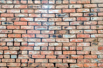 Old dirty vintage brick wall background close up