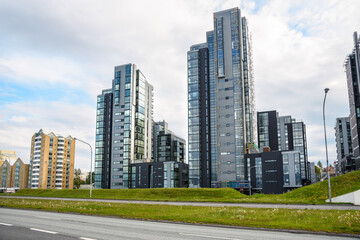 Fototapeta premium Newly built high rise apartment buildings along a urban road. Reykjavik, Iceland.