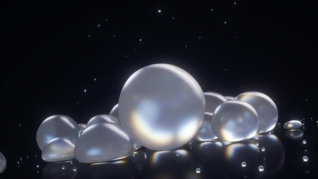 Bouncing liquid pearls over black background, animated