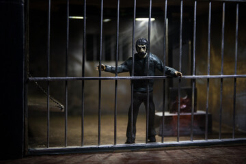 Jail or prison cell. Obsolete gray grunge concrete room. Creative artwork decoration. Horror view...
