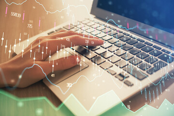 Double exposure of woman hands typing on computer and forex chart hologram drawing. Stock market analysis concept.