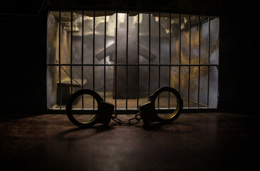 Old prison bars cell lock. Creative artwork decoration. Old grunge prison interior.