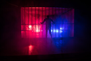 Jail or prison cell. Man in prison man behind bars concept. Old dirty grunge prison miniature. Dark...