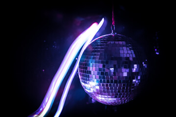 Colorful disco mirror ball lights night club background. Party lights disco ball. Selective focus
