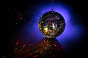 Colorful disco mirror ball lights night club background. Party lights disco ball. Selective focus