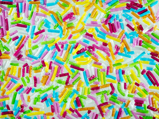 Fototapeta na wymiar Macrophoto. Abstract bright holiday background for your projects. Multi-colored sprinkles. For children, confectioners