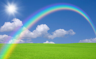 Obraz na płótnie Canvas 緑の草原と雲と虹と太陽