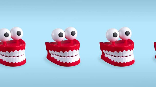 seamless looping animation of one row chattering teeth toys with big eyes on a blue pastel background. plastic red mouths with white fangs is a concept of oral hygiene and healthy teeth
