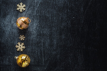 Obraz na płótnie Canvas Golden snowflakes with baubles for christmas