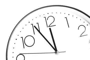 Clock showing five minutes until midnight on white background, closeup. New Year countdown