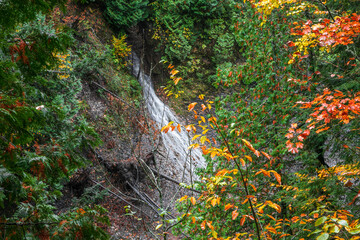 Scenic Potawatomi water falls through autumn trees in Michigan upper Peninsula