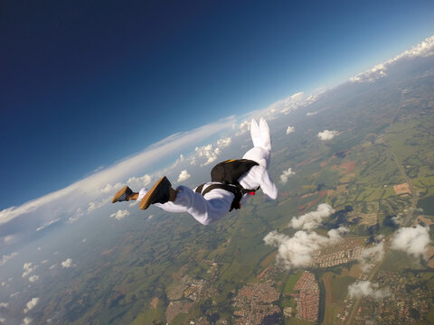Parachutist dressed as rabbit in free fall