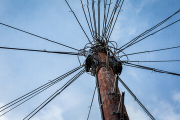 Top of a telegraph pole connecting lots of cables together