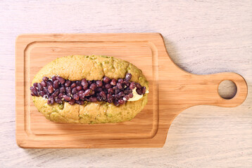 Red bean butter bread on wooden tray   