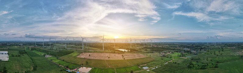 Fototapeta na wymiar wind turbines plant for electric power production silhouette at sunset ,clean energy concept